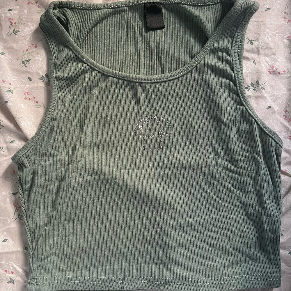 CUTE sage green cropped tank top with a bedazzled mushroom! Size is small.